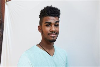 Portrait of smiling Black man raising eyebrow