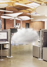 Cloud hovering in modern office