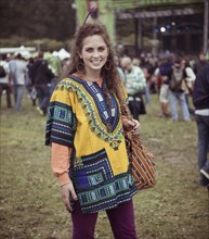 Woman wearing decorative poncho at festival