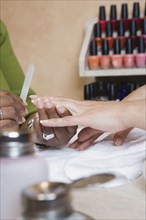 Close up of woman receiving manicure
