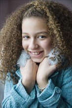 Mixed race girl in scarf and jacket