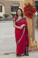 Smiling mixed race woman in Indian clothing