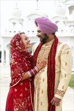Smiling couple in traditional Indian clothing