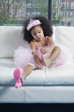 Mixed race girl in princess costume