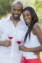 Black couple drinking martinis