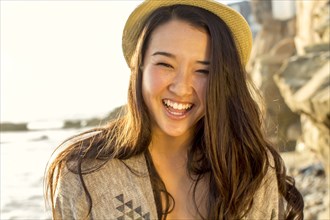 Japanese woman smiling on beach