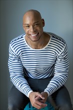 Mixed race man in striped shirt