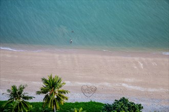 Aerial view of heart-shape on tropical beach