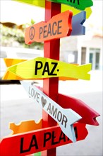 Colorful road signs to Peace and Love