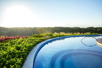 Infinity pool overlooking rural landscape