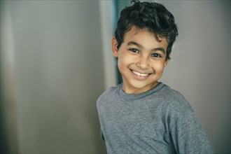 Mixed race boy smiling