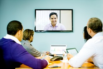 Business people having video conference in office meeting