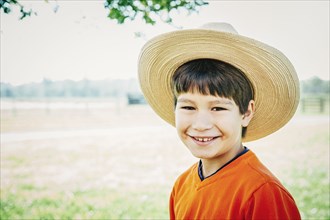 Caucasian boy smiling on farm