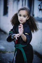 Mixed race girl practicing martial arts