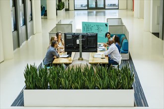 High angle view of business people working in office meeting