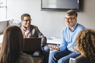 Business people talking in office meeting