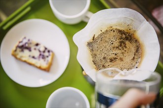 Caucasian man pouring breakfast coffee