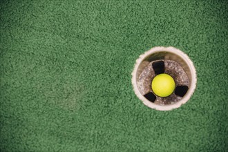 High angle view of golf ball in hole