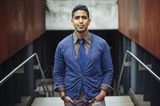 Indian businessman standing on office steps