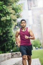 Indian man jogging in city