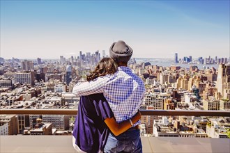 Indian couple admiring New York cityscape
