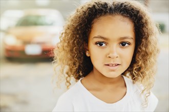Mixed race girl with serious expression
