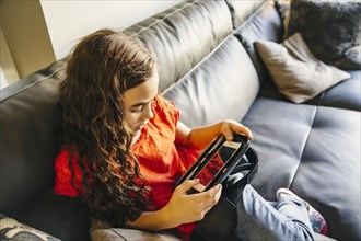 Mixed race girl using cell phone