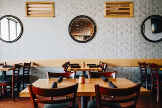 Empty chairs and tables in cafe