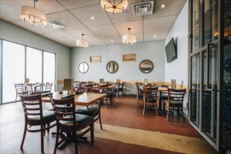 Empty tables and chairs in restaurant