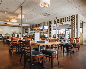 Empty tables and chairs in restaurant