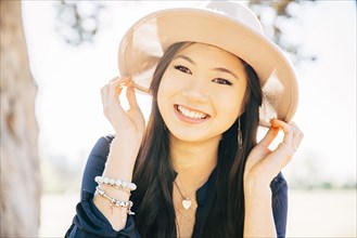 Chinese woman smiling outdoors