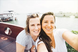 Women taking selfie on Ha Long Bay waterfront