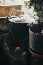 Close up of steamy pot cooking on stove