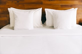 Empty bed in modern hotel room