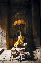 Offerings at shrine in Angkor Wat