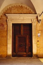 Ornate door with knocker in Bologna