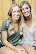 Portrait of smiling Caucasian mother and daughter