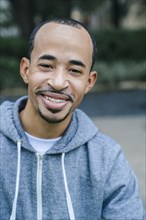 Portrait of smiling Black man with goatee