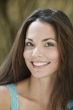 Close up of smiling Hispanic woman