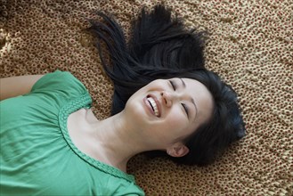 Korean woman laying on floor