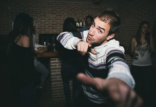 Smiling man dancing in nightclub