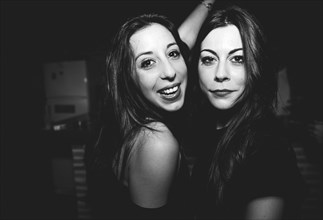 Smiling women dancing in nightclub