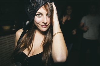 Smiling woman dancing in nightclub