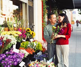 Couple buying a bouquet of flowers