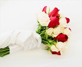 Gloved hand with wedding bouquet