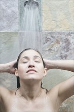Portrait of a woman taking a shower