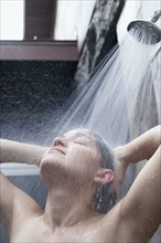 Portrait of a woman taking a shower