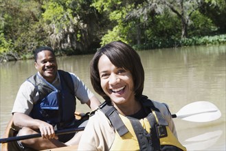 Couple smiling in canoe