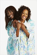Two African women wearing bathrobes