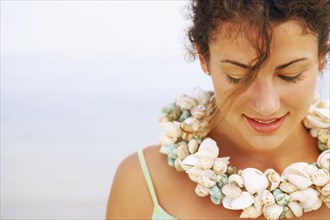 Woman wearing seashell necklace
